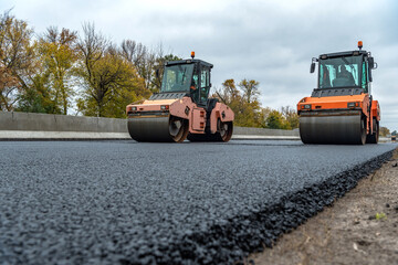 Laying a new asphalt on the road. Construction of the road.