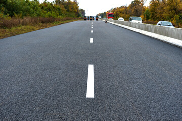 A new road with a dividing strip New Jersey. Road construction.