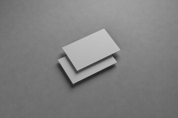 Mockup gray business cards on gray textured paper background. 3d rendering.