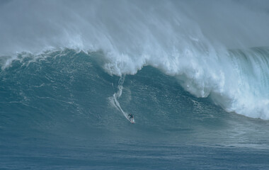 Sport photography. Jaws swell on International surfing event in Maui, Hawai 2021 December.