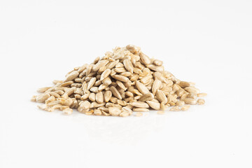 Raw seeds in a glass bowl isolated on white background.