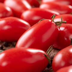 Fresh cherry tomatoes in a basket with spices.