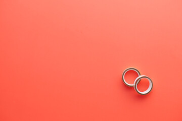 wedding ring on a red background with copy space 