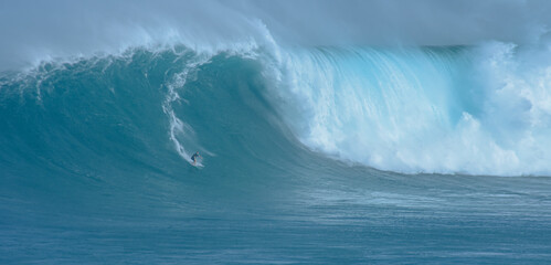 Sport photography. Jaws swell on International surfing event in Maui, Hawai 2021 December. - Powered by Adobe