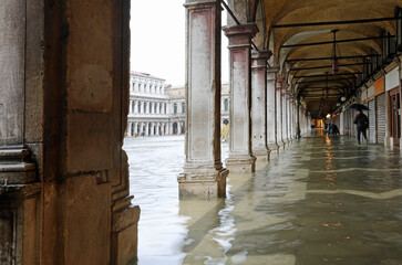 arcades of Saint Mark Square completely flooded during high tide on the Italian island of Venice