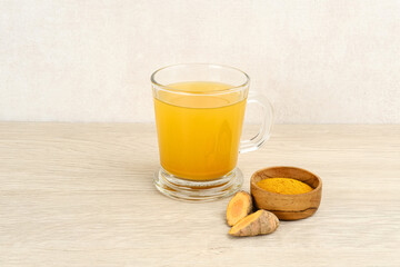 Turmeric tea, herbal drink. Indonesian traditional drink. Spices for alternative medicine concept. Copy space.
