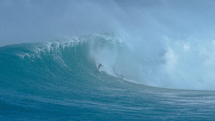 Sport photography. Jaws swell on International surfing event in Maui, Hawai 2021 December.