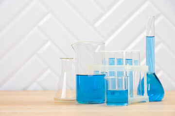 Laboratory glassware with test tubes. flasks, dropper, petri dishes, measuring cups and cylinders for scientific laboratories, laboratory equipment and analysis