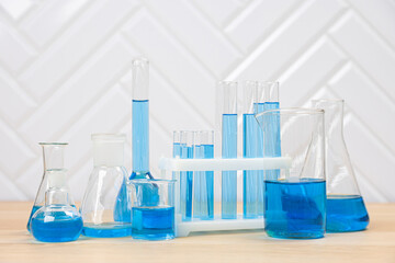 Laboratory glassware with test tubes. flasks, dropper, petri dishes, measuring cups and cylinders for scientific laboratories, laboratory equipment and analysis