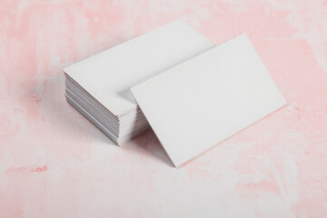 Business cards blank mockup on pink marble background mockup for design