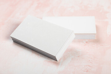 Fototapeta premium Business cards blank mockup on pink marble background mockup for design