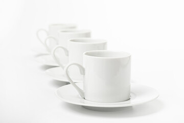several white porcelain cup and saucer for coffee isolated on white background