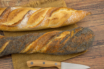 fresh bread and flour on a wooden table