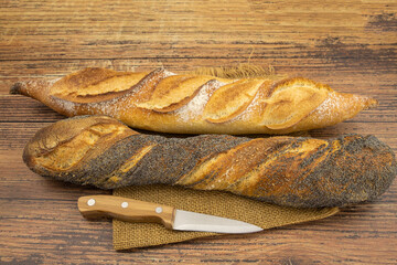 fresh bread and flour on a wooden table
