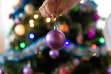 Soon Christmas and New Year, decorating the tree with toys