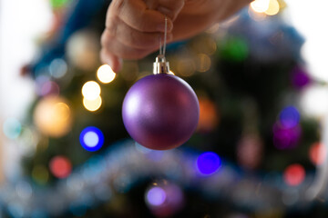 Soon Christmas and New Year, decorating the tree with toys