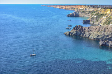 Cape Fiolent. Beautiful views of the Black Sea coast at Cape Fiolent in summer in clear weather. Aerial view to beautiful sea coast with turquoise water and rocks