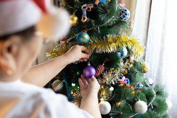 Soon Christmas and New Year, decorating the tree with toys