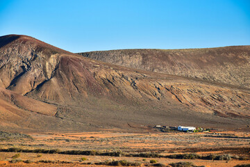 Beautiful volcanic landscape with a white house in front. Lanzarote , Canary Islands, Spain.