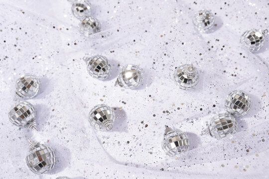 Shiny Silver Background With Disco Balls And Shiny Fabric With Sequins