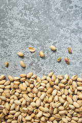 pistachio nuts on stone surface