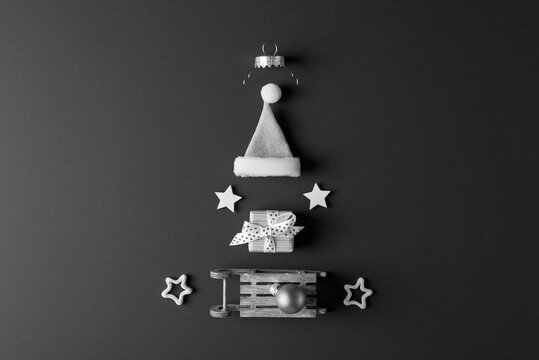 Xmas decorative elements arranged as Christmas tree. Black and white photo