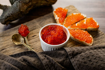 red caviar on wooden spoon