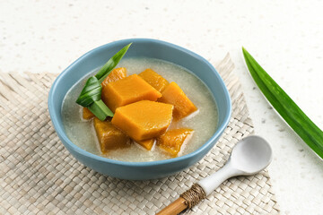 Pumpkin Kolak ( Kolak Labu Kuning) is a fast food appetizer (takjil) during Ramadan that is popular in Indonesia. Made from pumpkin, coconut milk and sugar. Served in tosca bowl, selective focus image
