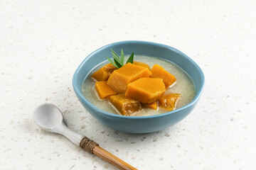 Pumpkin Kolak ( Kolak Labu Kuning) is a fast food appetizer (takjil) during Ramadan that is popular in Indonesia. Made from pumpkin, coconut milk and sugar. Served in tosca bowl, selective focus image