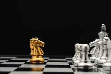Chess pieces on board game planning and competition on black background