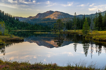 reflection in the mountain lake at sunset