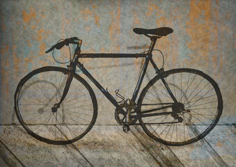 Fototapeta na wymiar old bicycle on the wall