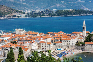 Obraz premium Panoramic cityscape of The Old Town of Budva, Montenegro, beautiful top view of Adriatic Sea and the Balkan Mountains