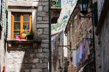 Ancient street, historical building in the old town of Kotor, Montenegro, Europe, Adriatic sea and mountains
