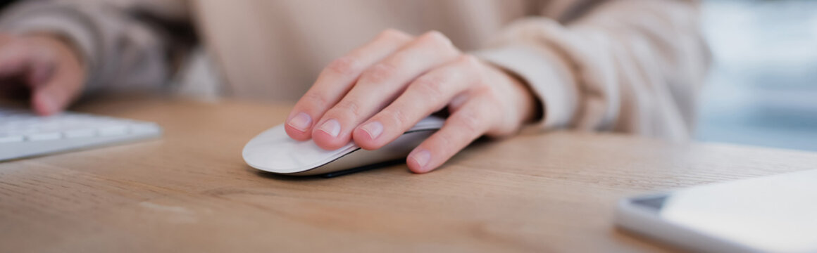 partial view of manager using computer mouse and keyboard in office, banner.