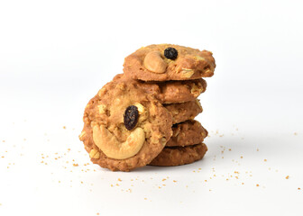Cookies stack with Cashews and Raisins on a white background