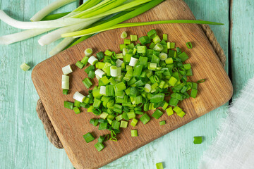 spring onion sliced for salad or seasoning on wooden surface - 476412277