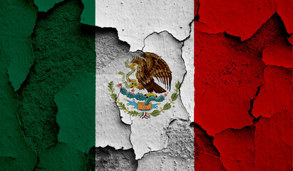 Flag of Mexico on old grunge wall in background
