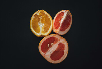 Top view of grapefruit and orange cut in half