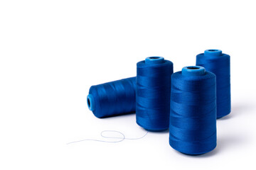 Threads of trendy electric blue blue on a white background. Copy space. Sidd view