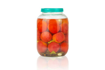 Canned tomatoes in a glass jar on a white background, canning, fermentation concept