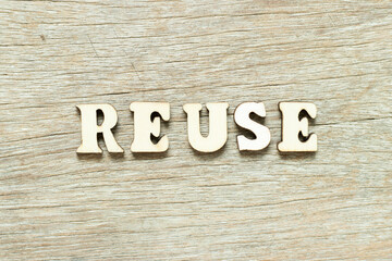 Alphabet letter in word reuse on wood background