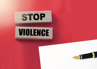 Stop violence words on Wooden building blocks on red. Stop racism concept.