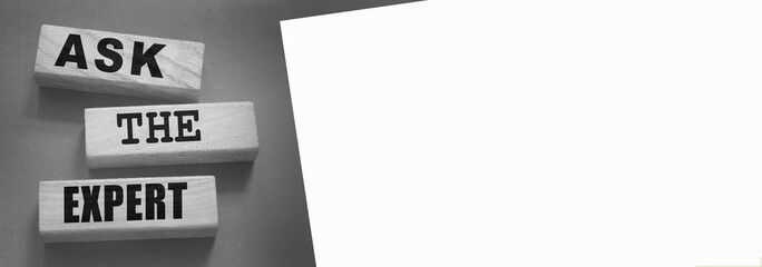 Ask the Expert words on wooden blocks. Consulting a professional, master or consultant for a solution and advice business concept