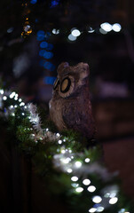 Owl as decoration with Christmas lighting.