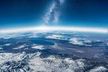 View of stars and milkyway above Earth from space. Beautiful space view of the Earth with cloud...