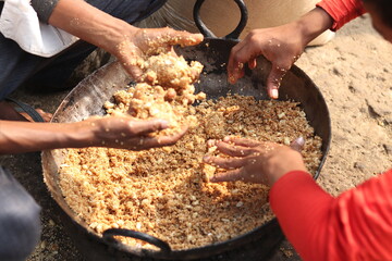 Rolling Roasted Sesame Seeds, Dry Fruits Kaju Badam Moonfali Mawa Malai Mungfali Nuts Mava With Hands To Make Mithai Gajjak Til Gul Gajak Laddu Or Tilgul Gazak Ladoo For Makar Sankranti And Lohri
