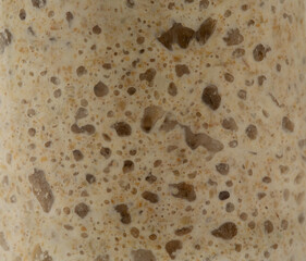 fresh rye sourdough on whole grain flour in glass jar, yeast-free leaven starter for healthy organic rustic bread. close up. Healthy eating.