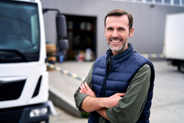 Portrait of caucasian mature man in front of warehouse - Powered by Adobe