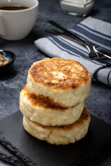 Curd cheesecakes, fried cheesecakes Cheesecakes on a dark background